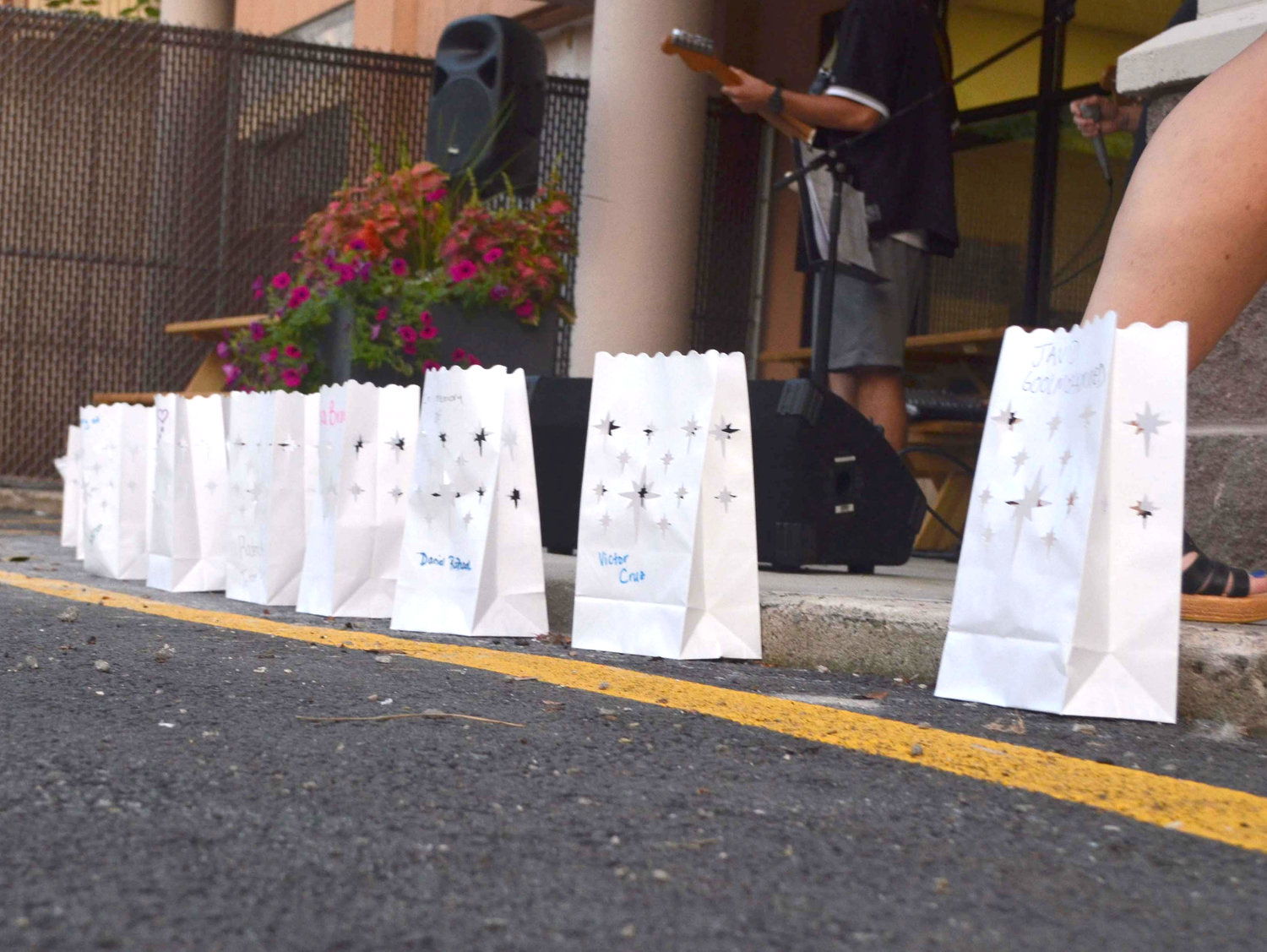 The names of those lost to overdose in Sullivan County stand written on paper bags at a vigil for International Overdose Awareness Day held on August 31, 2021.